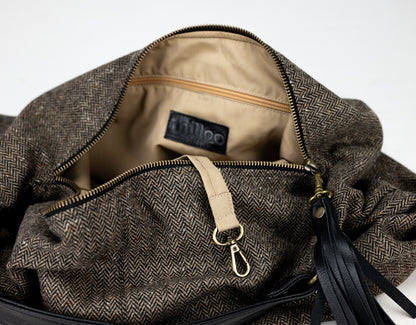 Brown textured bag with a visible brand label on a white background