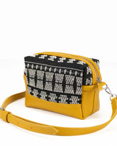 Yellow crossbody bag with black and white patterned flap 