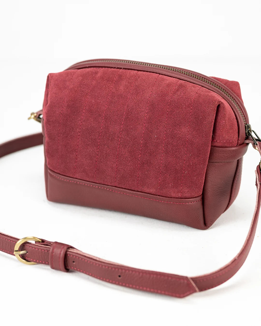 Red crossbody bag on a white background