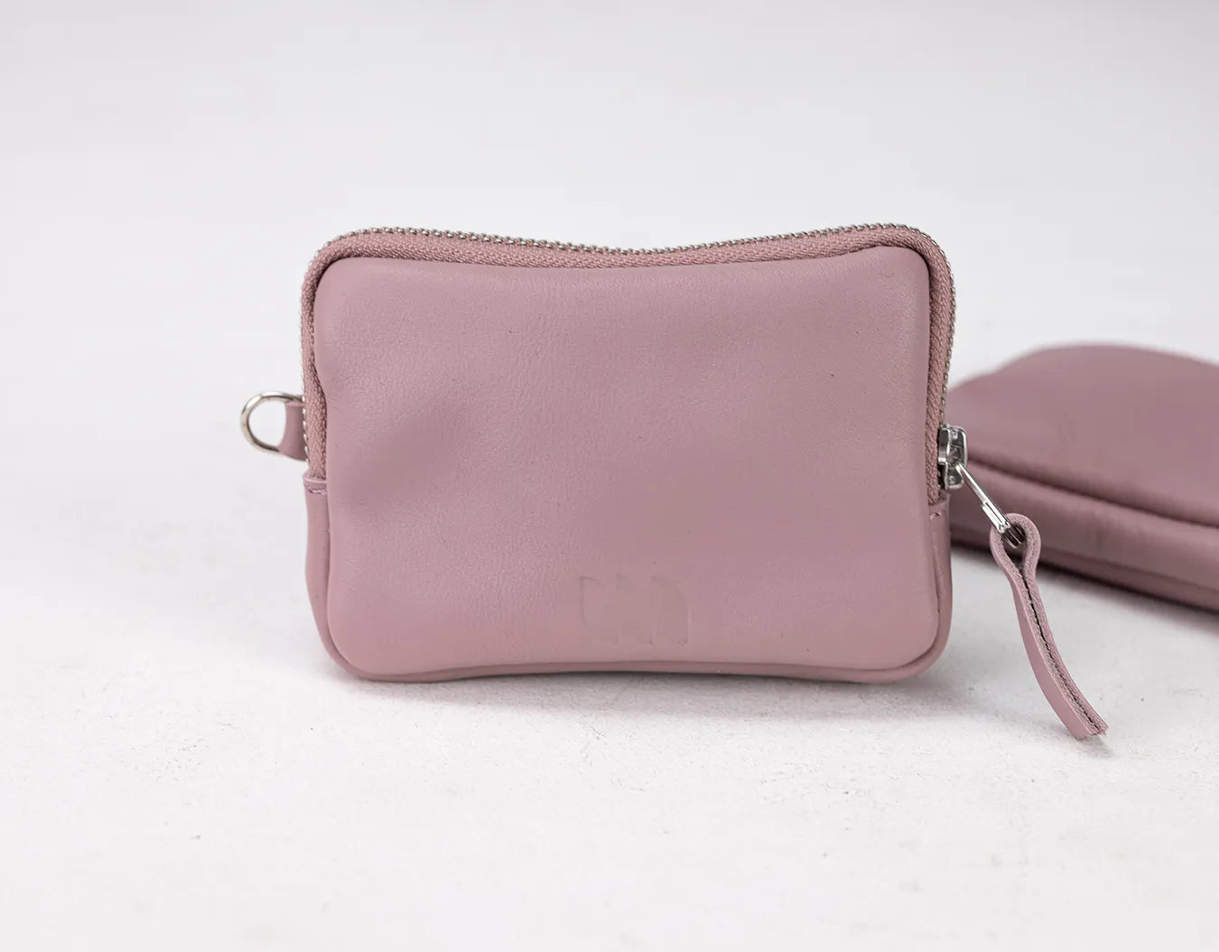 Pink pouch with a strap on a white background