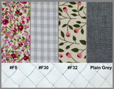 Four fabric swatches with floral, checkered, and leaf patterns on a tiled background.