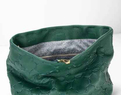 Green textured handbag with gold clasp on a white background