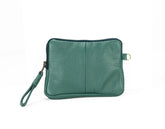 Green leather clutch bag on a white background