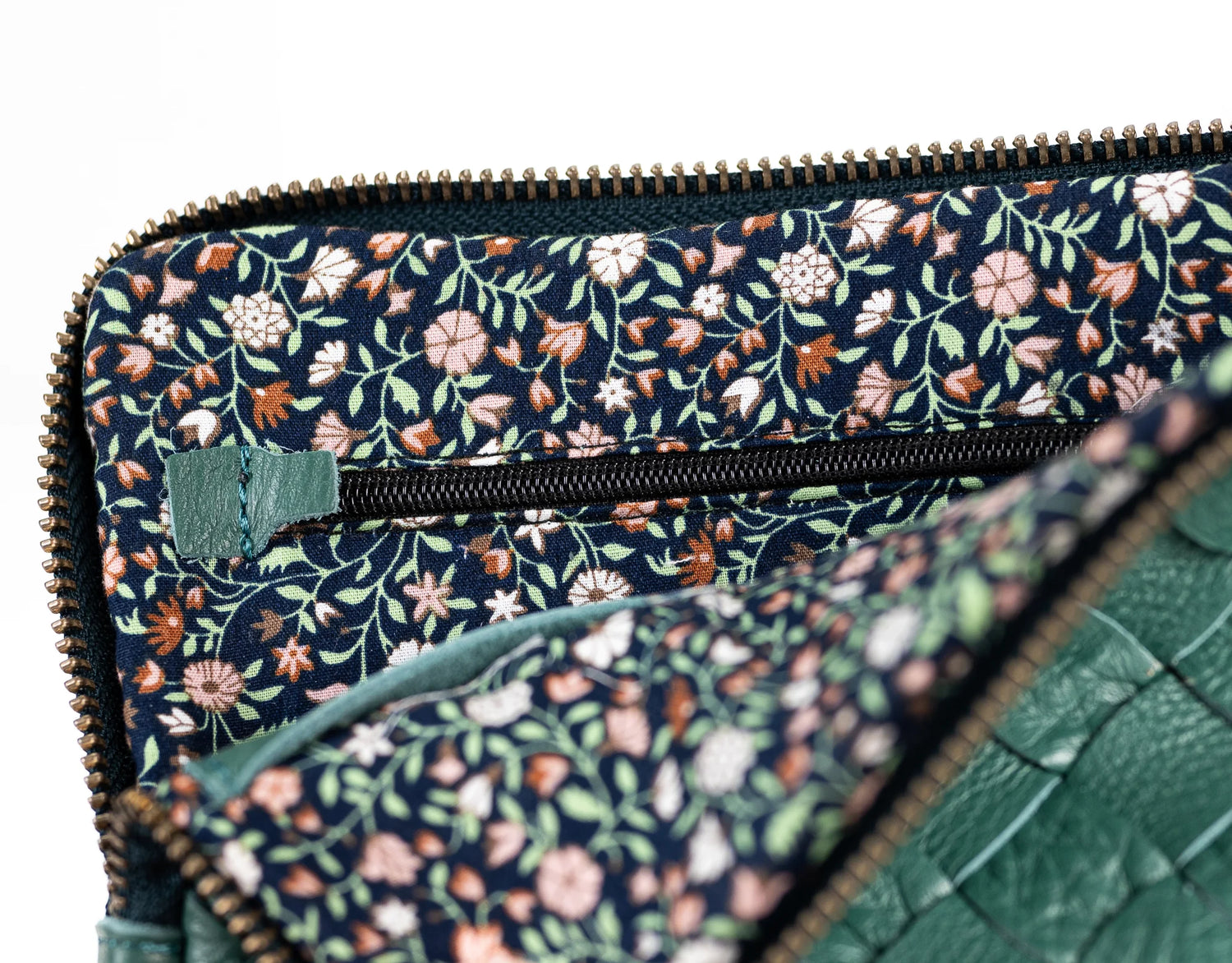 Floral patterned clutch bag with green accents