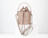 powder pink quilted backpack on a white background