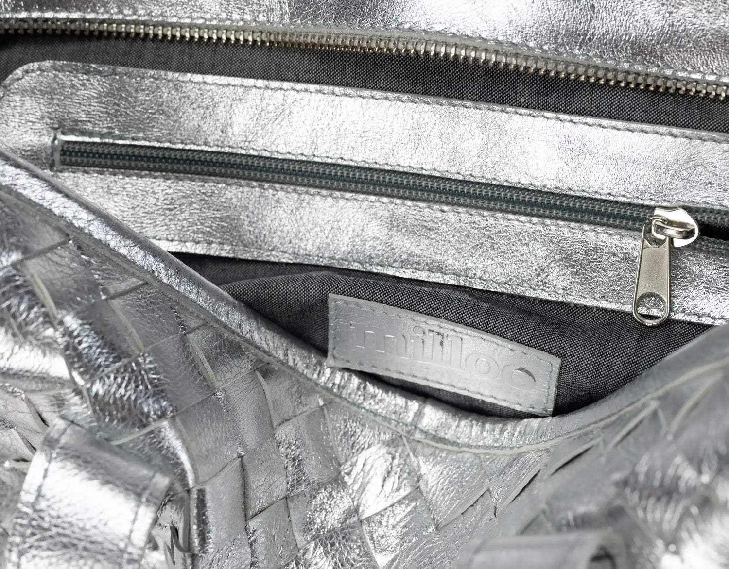 Close-up of a silver metallic handbag 