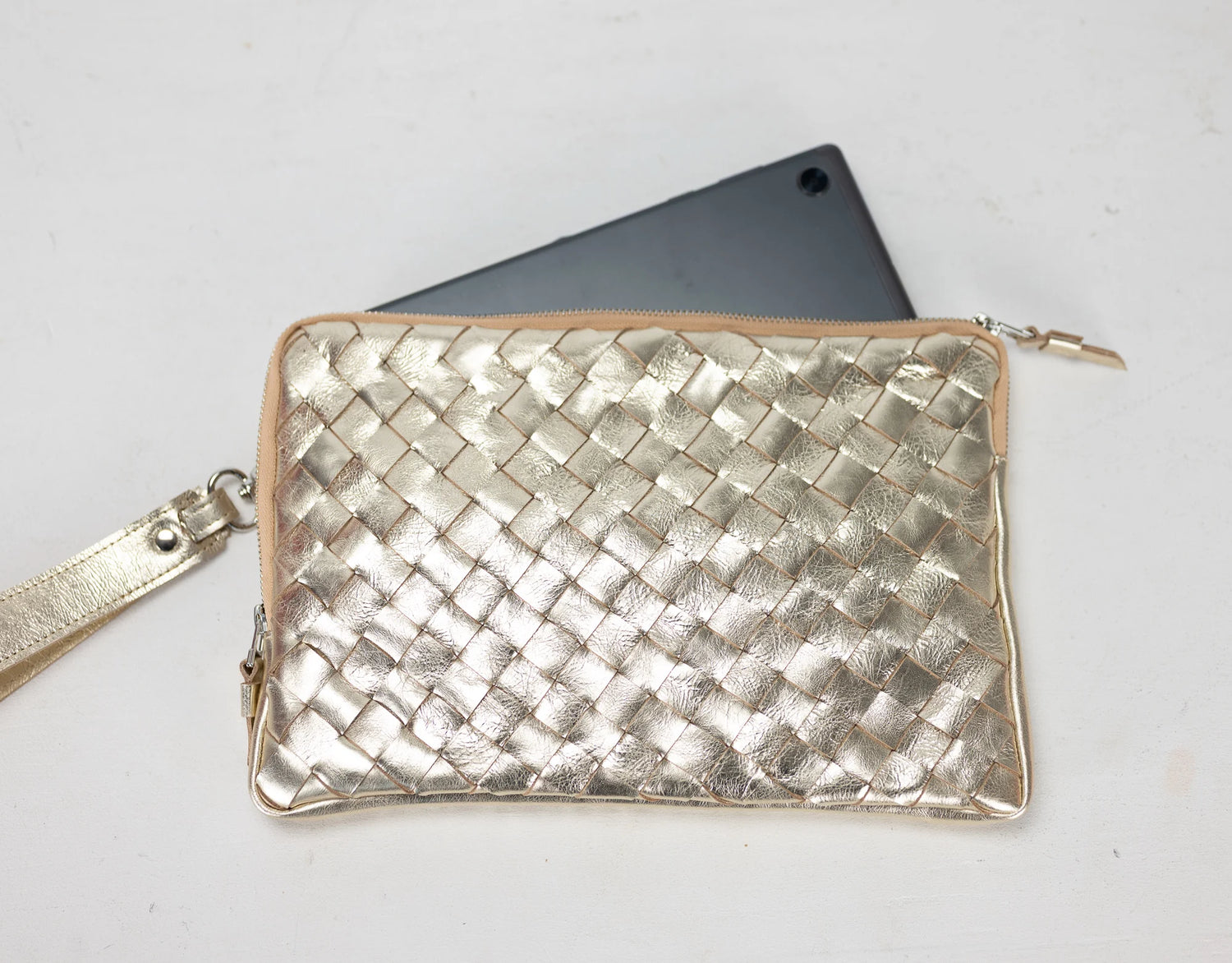 Yellow Gold woven clutch bag on a white background