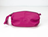 Pink pouch with a tassel on a white background
