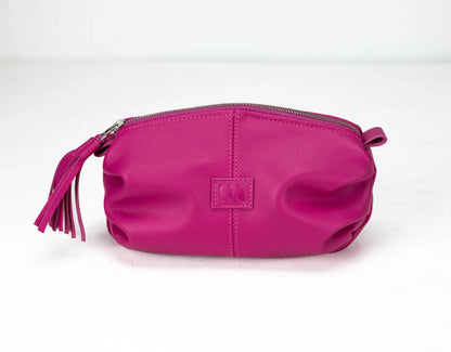 Pink pouch with a tassel on a white background