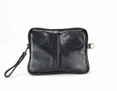Black leather clutch bag on a white background