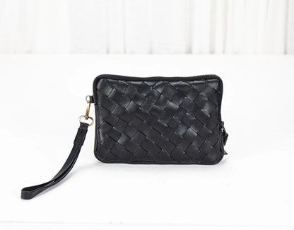 Black woven handbag on a white background