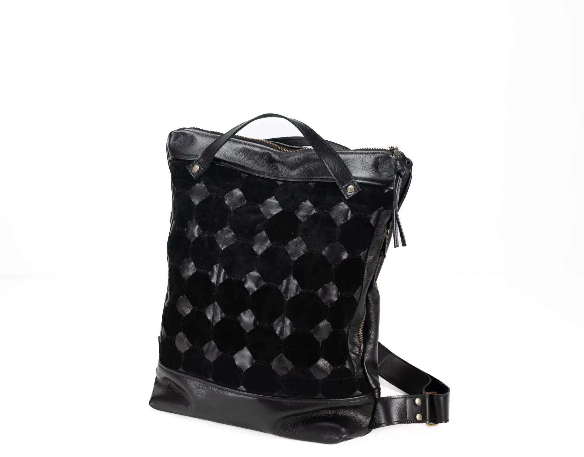 Black quilted backpack on a white background