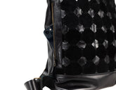 Black textured backpack with a visible brand logo on a white background