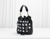Black and white checkered handbag on a white background