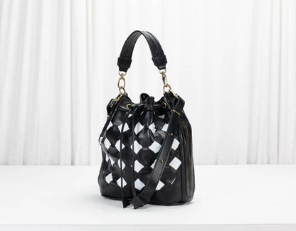 Black and white checkered handbag on a white background