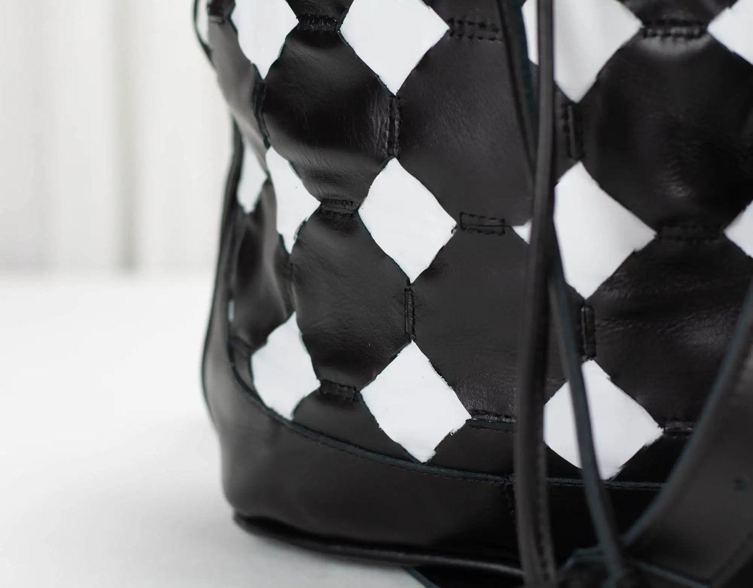 Black and white patterned bag on a light background