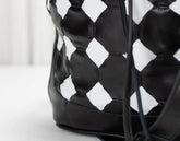 Black and white patterned bag on a light background