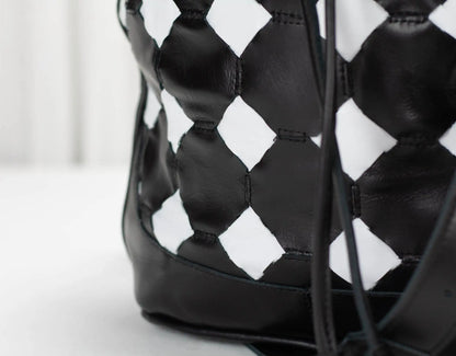Black and white patterned bag on a light background