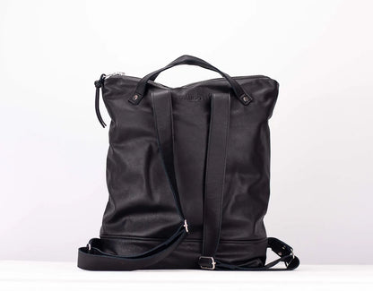Black leather backpack on a white background