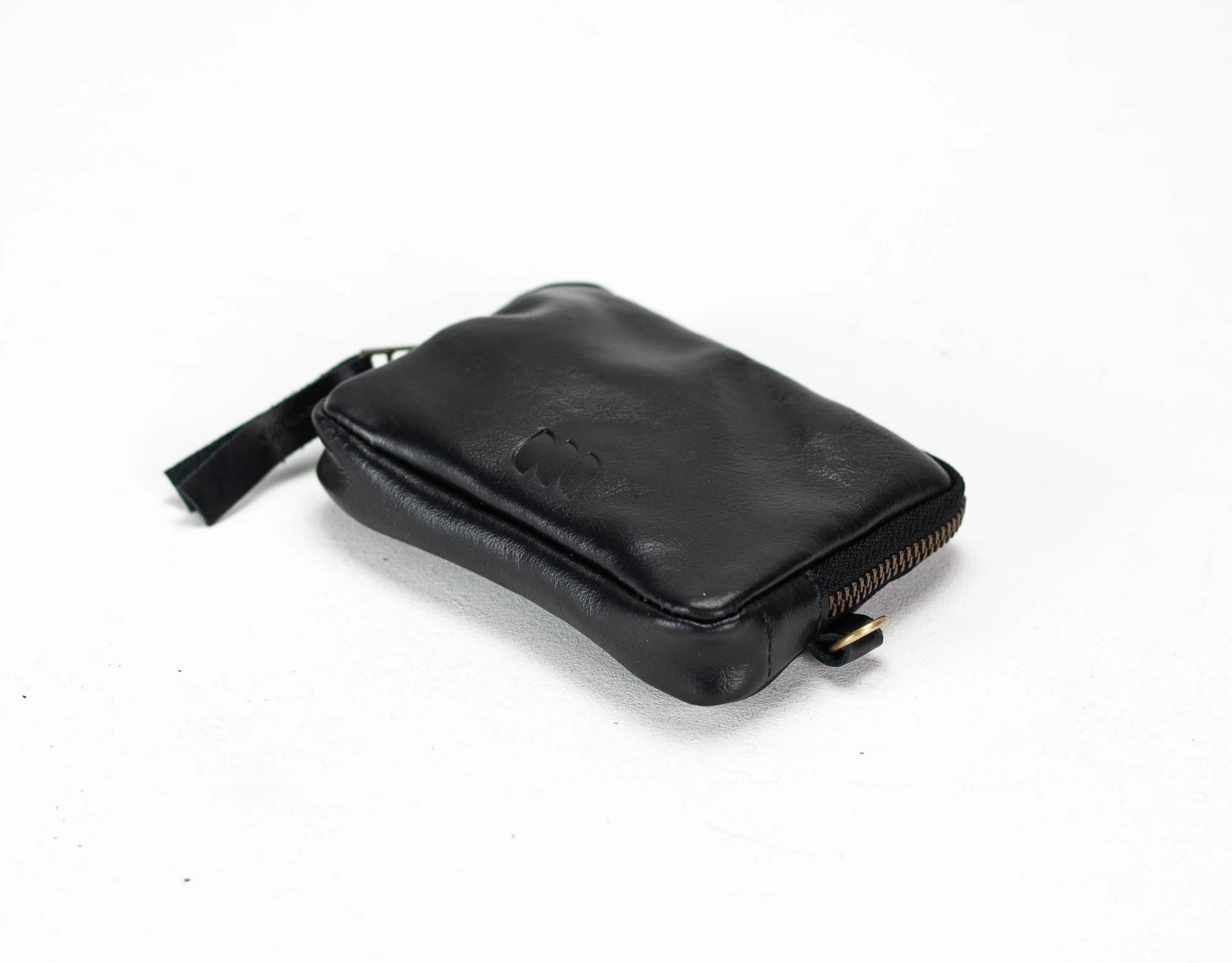 Black leather pouch with keychain and smartphone #color_black