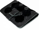 Black leather wallet with a buckle on a white background