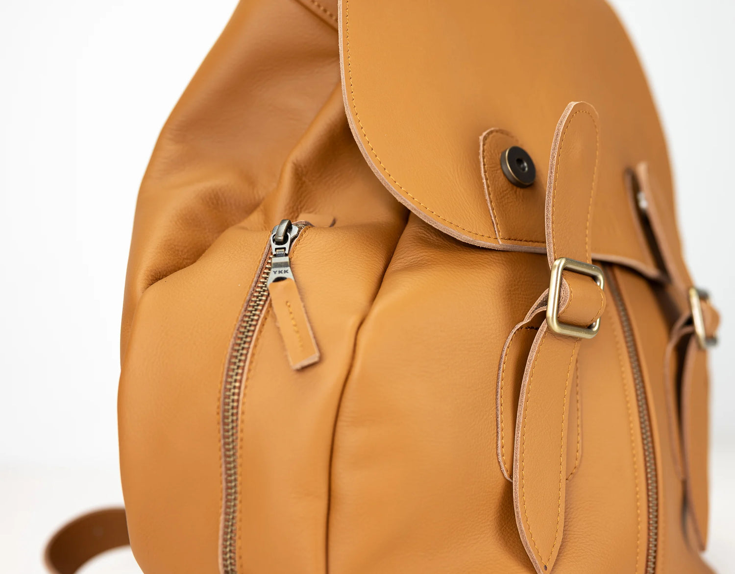 Brown leather backpack with zippers