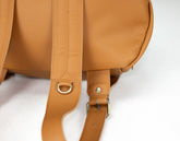 Brown leather backpack with adjustable straps