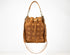 Brown leather bucket bag with geometric pattern on a white background