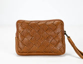Brown woven leather clutch bag on a white background