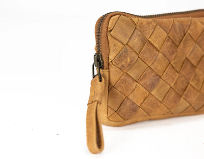 Brown woven leather clutch bag on a white background