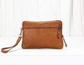 Brown leather crossbody bag on a white background