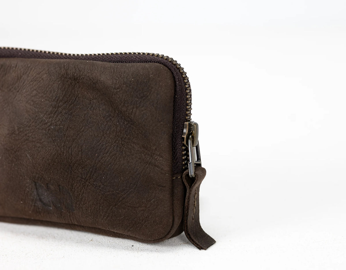 Brown leather pouch with a zipper on a white background#color_brown-nubuck