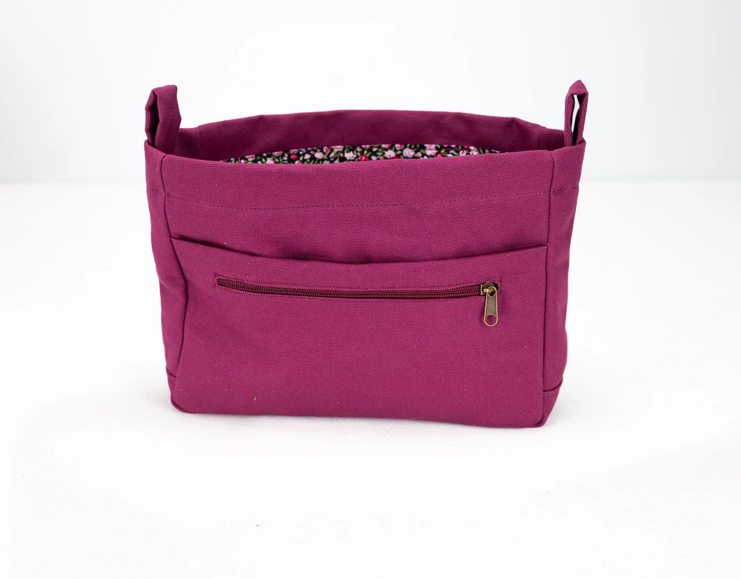 Purple bag with a zipper pocket on a white background