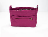 Purple bag with a zipper pocket on a white background