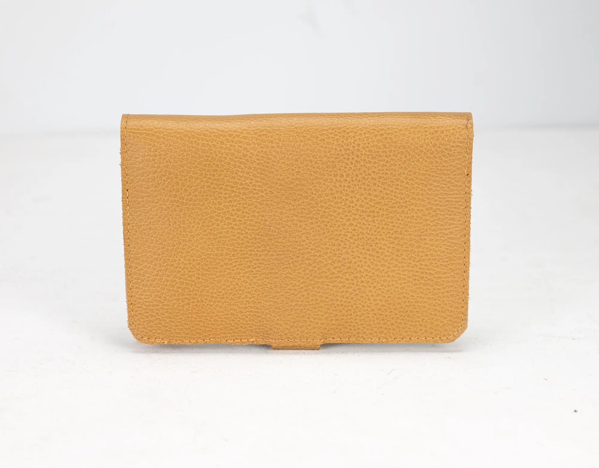 Tan leather wallet on a white background