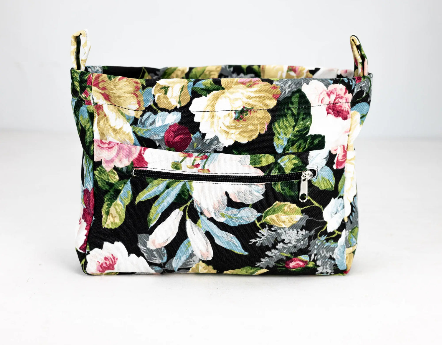 Floral-patterned bag with a black background