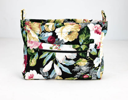 Floral-patterned bag with a black background