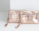 Rose gold handbag and clutch on a white background