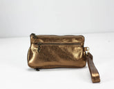 Brass metallic handbag with a strap on a white background