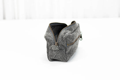 Gray textured pouch with a zipper on a white background