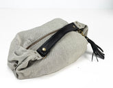 Gray pouch with a black zipper and tassel on a white background