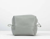 Light gray leather pouch on a white background