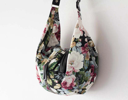 Floral patterned handbag on a white background