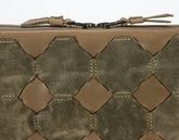 Close-up of a tactical pouch with woven pattern and visible brand logo.