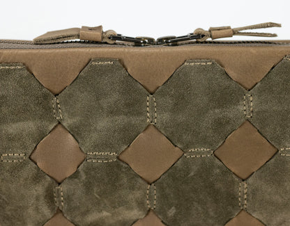 Close-up of a tactical pouch with woven pattern and visible brand logo.