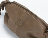 Brown leather pouch with a zipper on a white background
