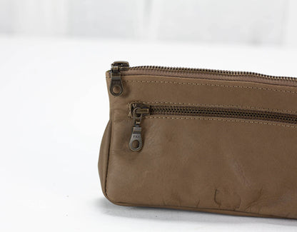 Brown leather bag with a zipper on a white background