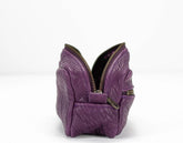 Purple butterfly-shaped purse with a zipper on a white background