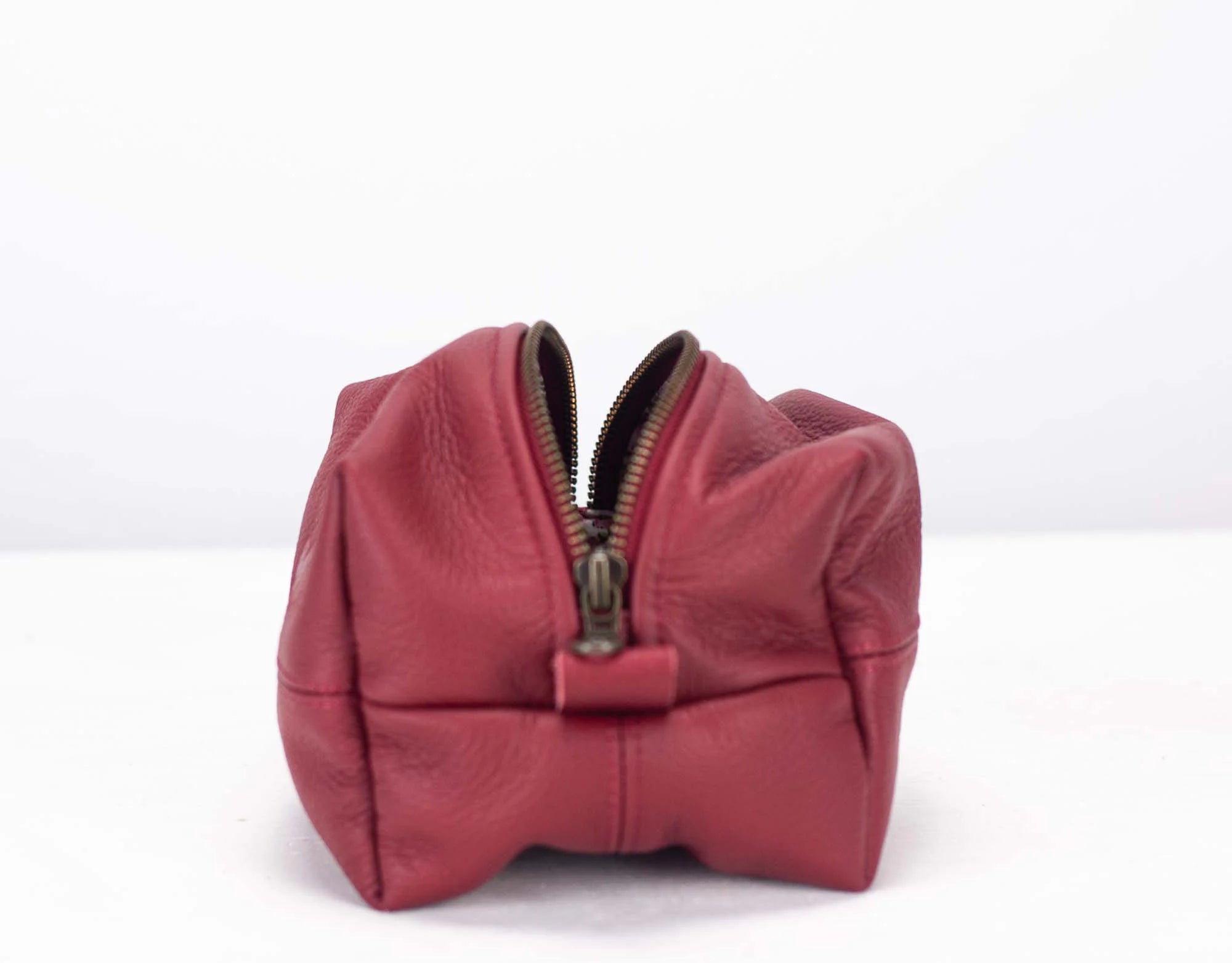 Deep red leather cube case with brass zipper
