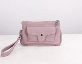 Pink handbag with a strap on a white background